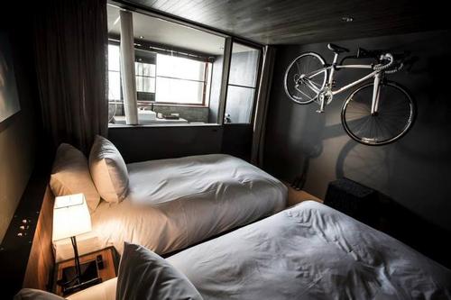 Wall hooks in every bedroom enable cyclists to keep their bikes close by / Credit: Hotel Cycle