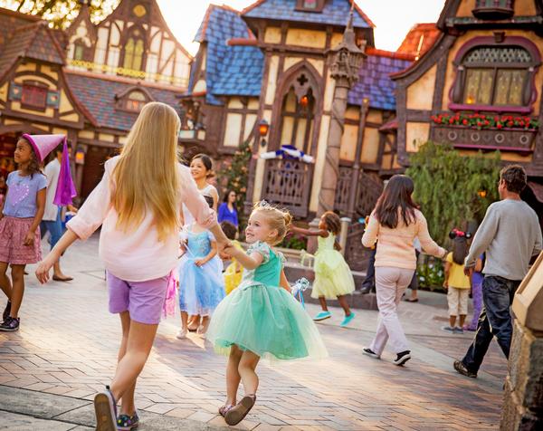 Girls rush to Fantasy Faire at Disneyland, where guests can meet the Disney princesses