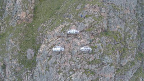 The three sleeping capsules, created and designed by Ario Ferri, sit 400m high on a cliff face