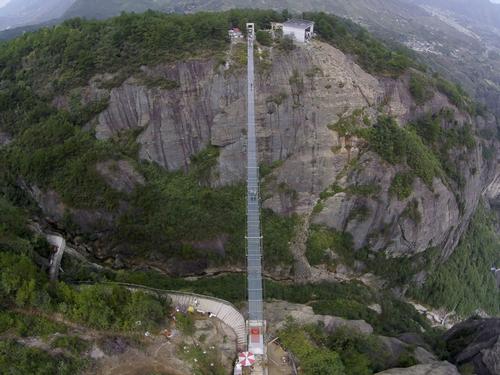A 180-metre-deep chasm sits below the glass suspension bridge / Haim Dotan