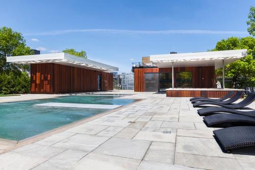  The containers were in reference to the spa’s river location and also frame the garden with views of the surrounding grain silos / MU Architecture