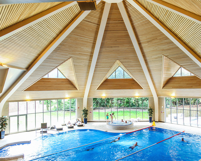 The timber roof is complex in design because of the triangular openings / 