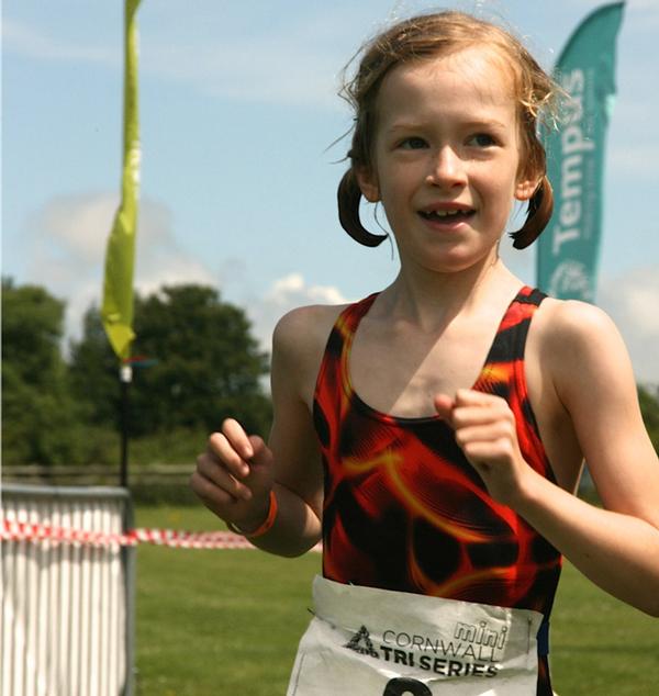 Meribel, the author's daughter, competing in the mini triathlon