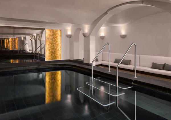 The South Kensington Club pool features dark lava stone tiles and seawater imported from Sicily