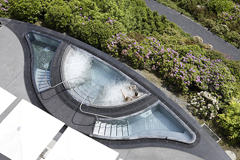 The outdoor whirlpool has been purposefully positioned so users overlook the city of Zurich while taking to the waters