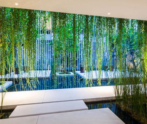 The ground floor contains open spaces with relaxing platforms surrounded by lotus ponds and hanging gardens / Oki Hiroyuki