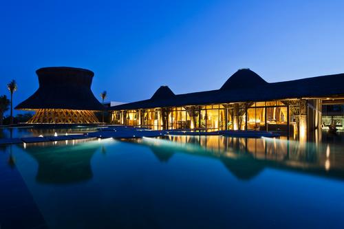 The bar sits next to the resort's infinity pool / Vo Trong Nghia Architects
