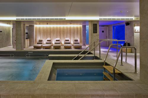 Day beds and heated ceramic loungers line the outside of the wet zone / Raison d'Etre
