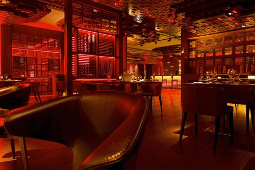 The blazing interiors were created with glowing metal rods, translucent bricks and wooden blocks / Blue Sky Hospitality