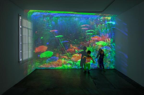 The exhibit used top-of-the-range laser projectors, but required lamp-based units to display the artist’s earlier works