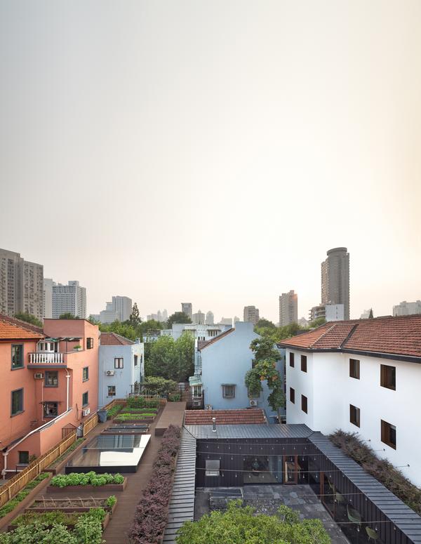 The building, with its urban farm, is nestled into a popular residential area of Shanghai
