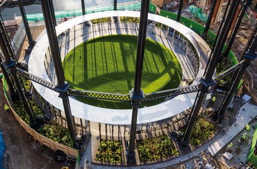 A stainless steel canopy is encased by the frame and surrounds the park / Bell Phillips Architects