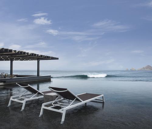 The property offers an freshwater infinity pool with a swim-up bar and a saltwater pool built into a natural rock formation / Thomas Hart Shelby