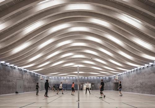 A look inside the existing sports hall, which was completed in 2013 / Rasmus Hjortshoj / BIG