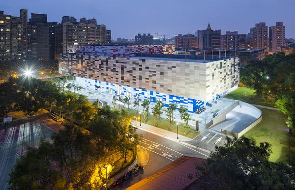 At night the Tucheng Sports Centre in Taipei is lit up internally, giving it a translucent quality