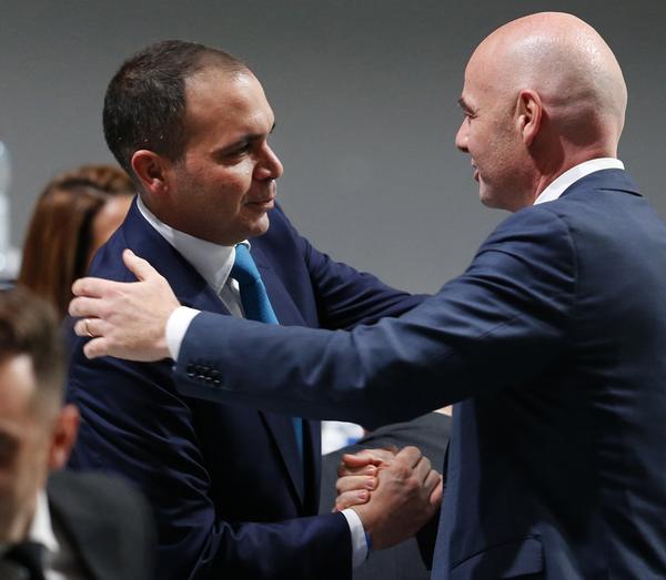 Prince Ali al-Hussein of Jordan, who came third in the voting rounds, congratulates Infantino