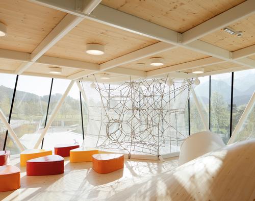 The multi-level play structure offers a wide variety of play experiences for children / Snøhetta Architects