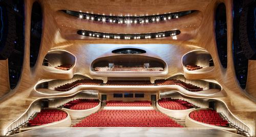 The 1,600-capacity grand theatre is sculpted from Manchurian Ash which wraps around the venue / Hufton+Crow