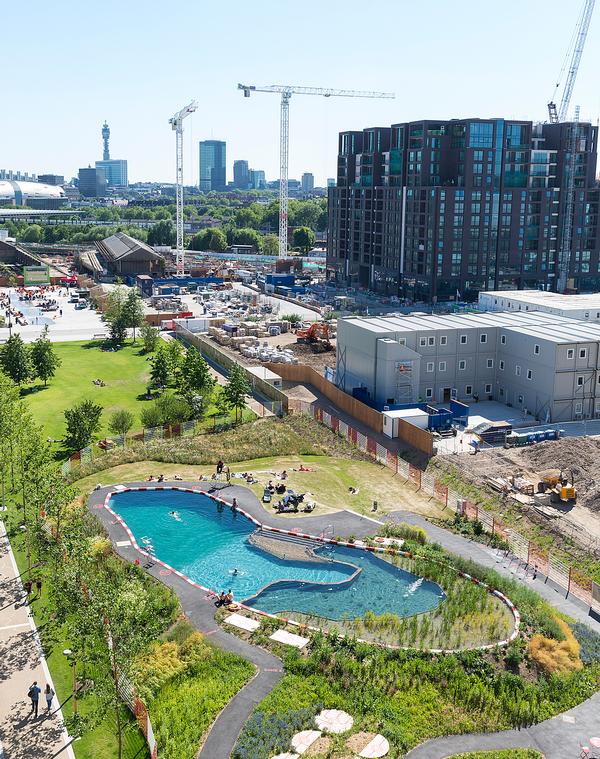 The pool is surrounded by grass and trees and has a viewing deck, changing rooms, sauna and showers. It’s part of the Kings Cross public art programme, Relay / IMAGE: JOHN STURROCK