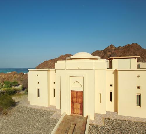 Al Bustan Palace is a beachfront retreat that is tucked away between the rugged Al Hajar Mountain range and the Sea of Oman / Six Senses