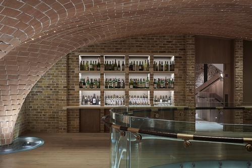 The Sussex cellar design is influenced by Spanish bodegas and uses handmade London tiles