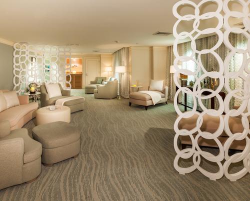 The upgrade spa compliments the aesthetics of the oceanfront with tones of aqua and greens layered into the design / Ritz-Carlton