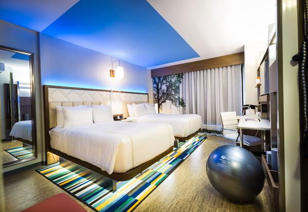 Even Hotels: In-room training zones offer functional equipment, and there are also fitness videos to follow