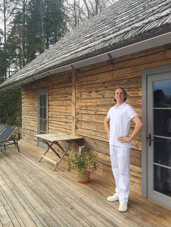 Aigars, the sauna maste uses birch branches to massage and stimulate the skin as well as to circulate the hot air around the cabin
