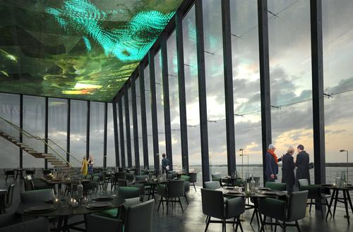 Moreau’s winning design features a series of charred timber and glass angular pavilions overlooking Helsinki Harbor