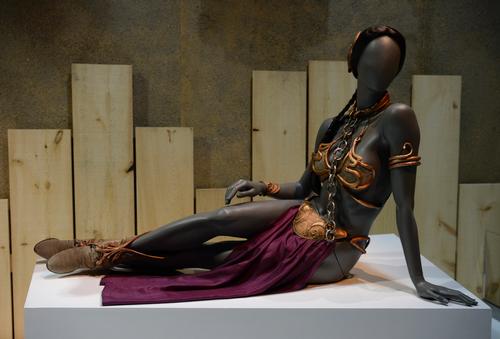Props used in the movies, such as Princess Leia's slave costume are featured / Discovery Times Square