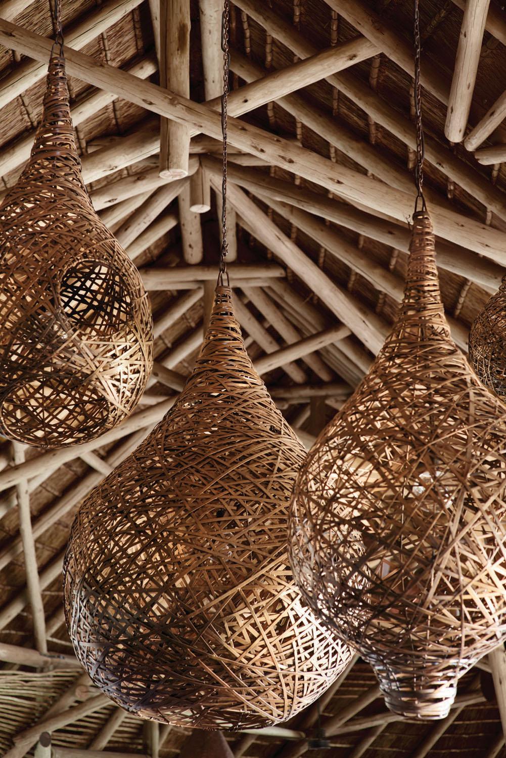 Lanterns in the lodge are designed to resemble nests / Belmond Eagle Island Lodge Botswana