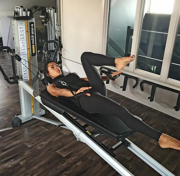 Using Total Gym, the studio teaches pilates on both an upright and an angled plane