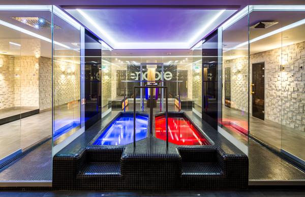 The use of mirrors and multi-level lighting in the club creates a great sense of space