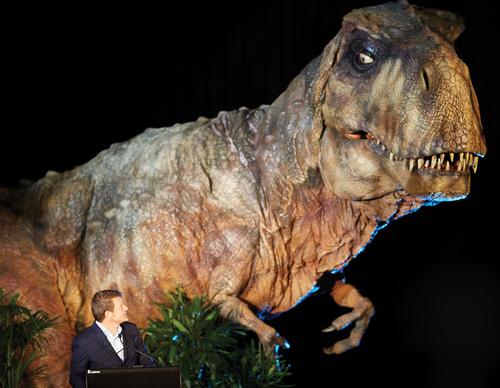 Imagine Exhibition's Tom Zaller with one of the life-size animatronic dinosaurs / Imagine Exhibitions