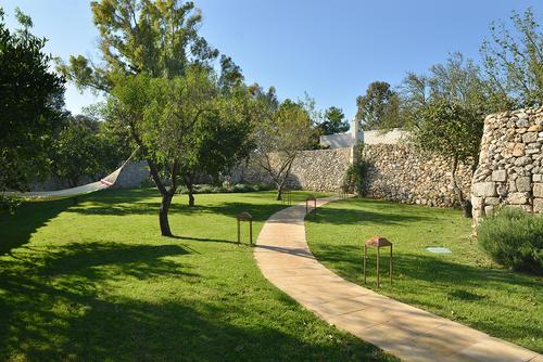 Masseria Trapana also has six tranquil gardens with hammocks surrounded by nineteen varieties of fruit and nut tree / Masseria Trapana 