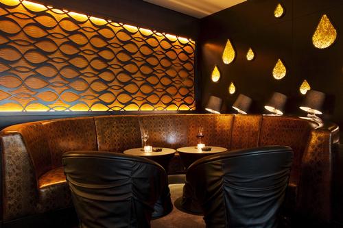 The lounge area of OroNero features black gold leather seats and intricate fretwork panels in ebonised timber / Blue Sky Hospitality
