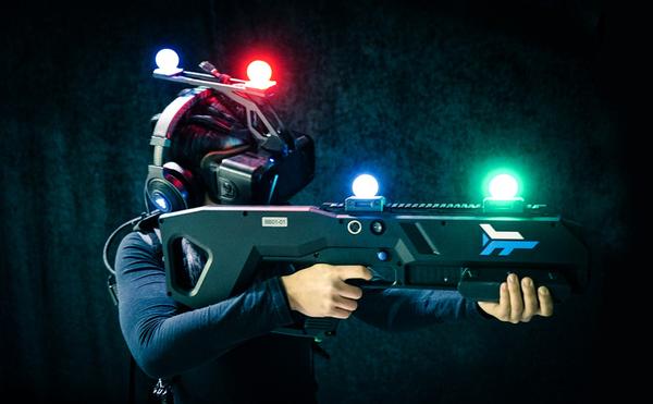  Zero Latency VR players are equipped with HMDs, backpack PCs and controllers, which act as virtual weapons