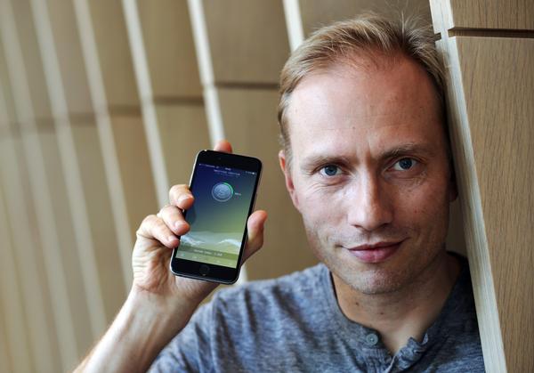 Co-founder Oleg Fomenko 
with the Sweatcoin app / PHOTO: REUTERS/Paul Hackett