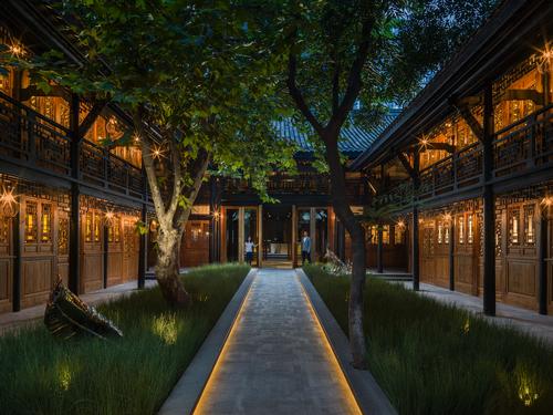Bamboo trees frame the hotel’s entrance, which is set in a restored hundred-year-old Chinese courtyard building