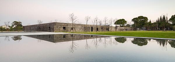 At the Tsingpu Yangzhou Retreat, reclaimed brick walls create multiple courtyard enclosures