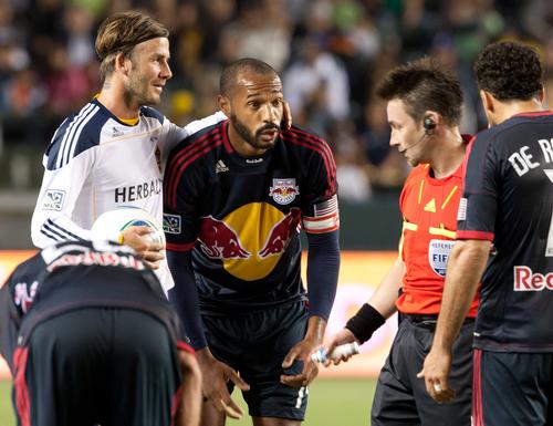 A number of stars – such as David Beckham (left) and Thierry Henry – have chosen to play in the MLS in recent years
