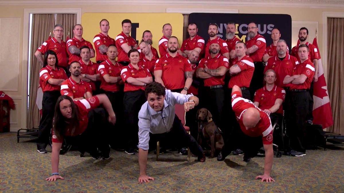 Trudeau joined two team members in push-ups before doing a pretend mic drop and shouting “BOOM!”