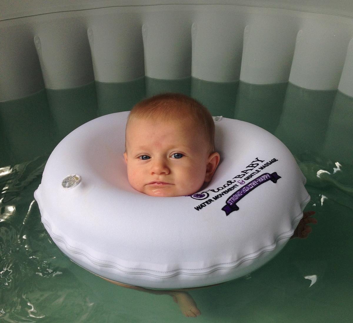 After their swim session, babies receive a pampering massage from their parents / Float Baby