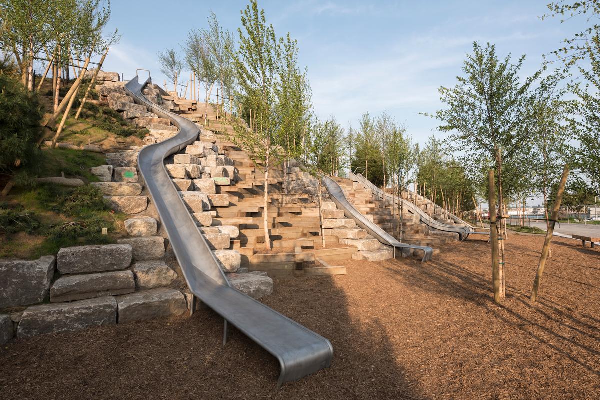 Four slides descend Slide Hill / Timothy Schenck