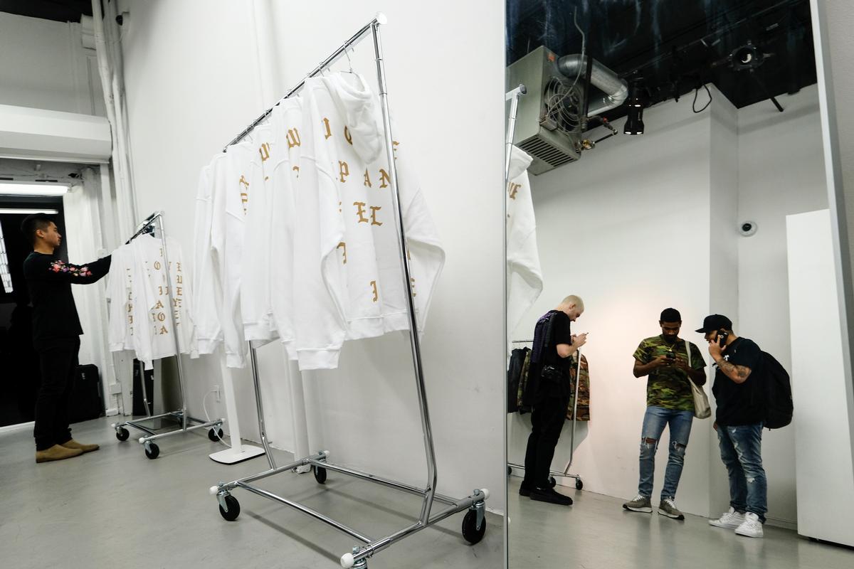 Each Life of Pablo store was designed by West and his creative design company DONDA to be sparse and minimalist, with white and ceilings and simple fittings / Evan Agostini/AP/Press Association Images