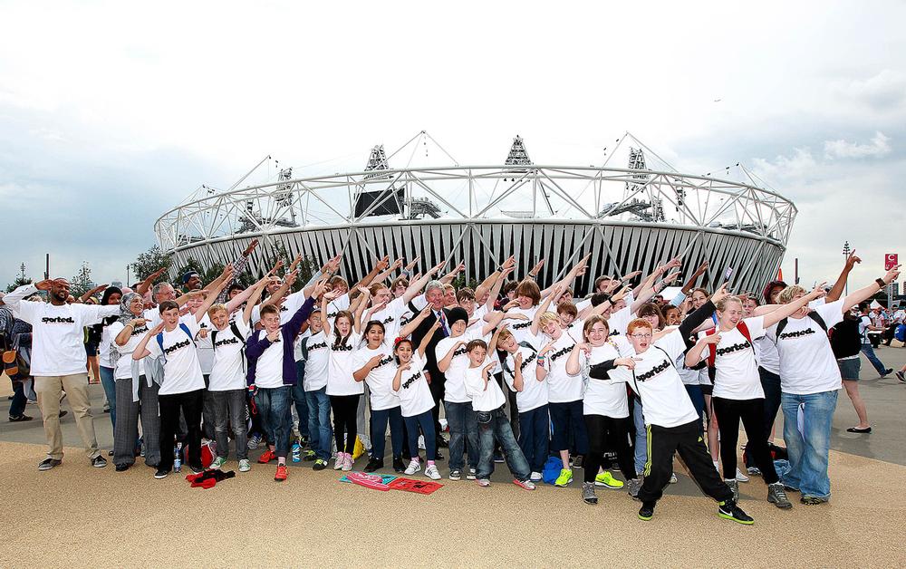 Building a sporting legacy: Sir Keith Mills with youngsters outside the Olympic Stadium in East London