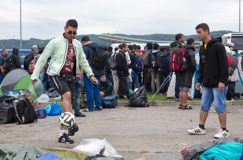 For hundreds of thousands of refugees starting a new life in Europe, football is the only language they share with their new neighbours
