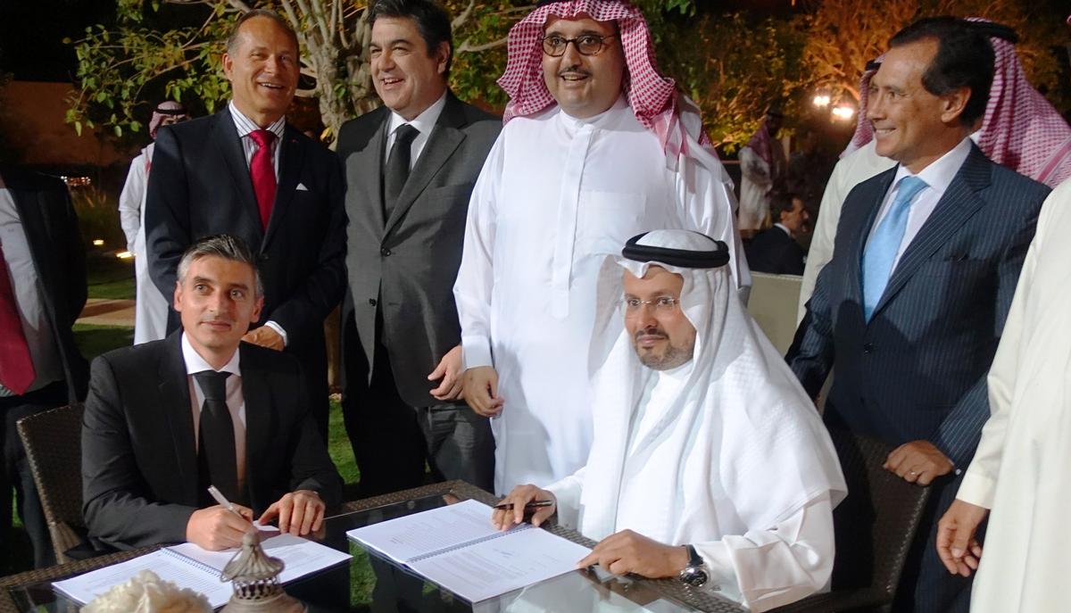 Rui Urbano, partner at Vivafit (sitting, left) signing the deal with Ithraa CEO Eid Al Shamri (sitting, right)