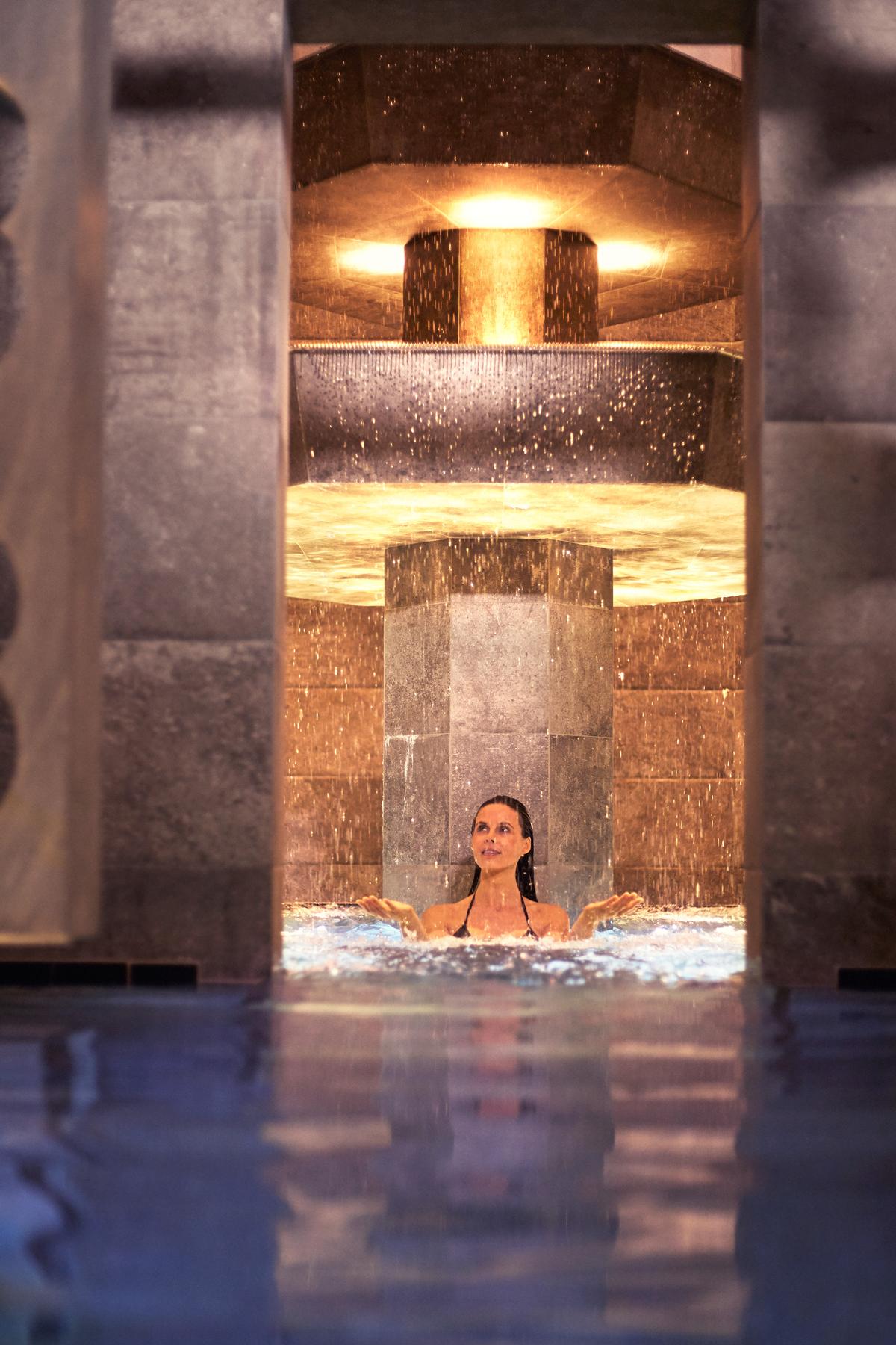 The spa gravitates around a central tower and three-storey cascade fountain, which the thermal water flows from