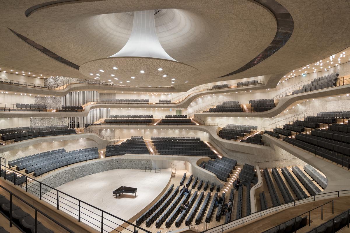 The 12,500-tonne concert hall, which is housed in the heart of the glass volume, rests on 362 giant spring assemblies to decouple it from the rest of the building / Iwan Baan